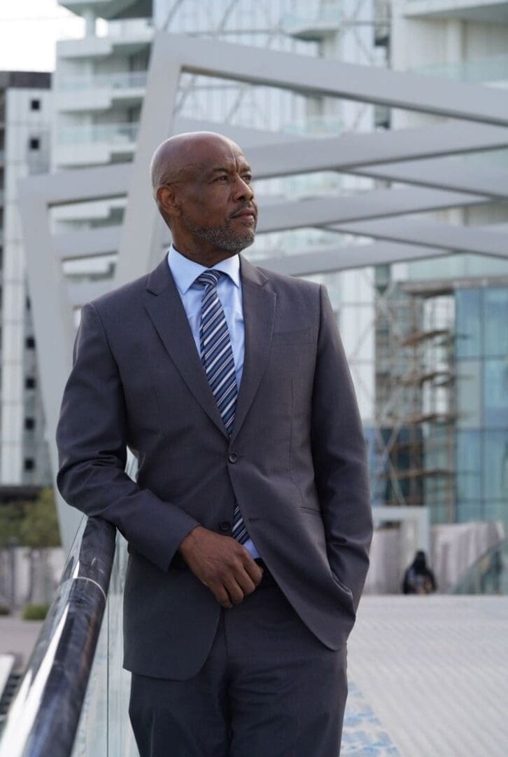 Businessman standing on urban walkway