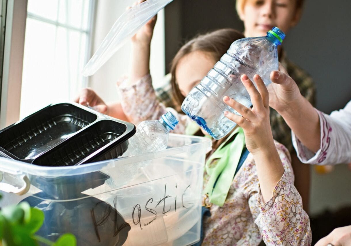 Kids learning about recycling plastic containers