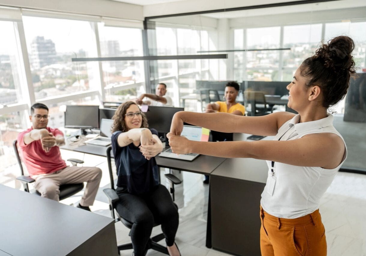Workplace stretching led by an instructor